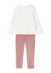 White long-sleeve top paired with soft, pink velvet pants. Features a rounded neckline and tapered leg design.