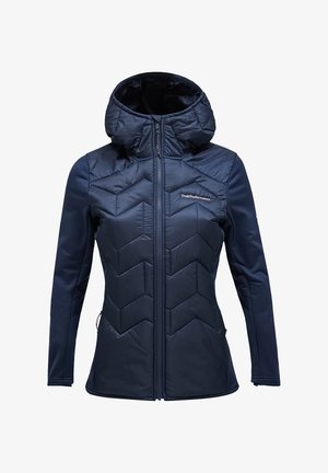 Navy blue jacket featuring a padded design with chevron stitching, zippered front, and a hood. Textured fabric with a smooth finish.