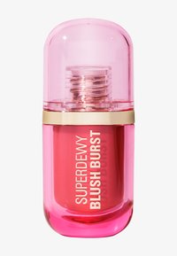 En beholder med blush med en rund, rosa topp og en klar base. Etiketten viser "SUPERDEWY BLUSH BURST" i hvit med detaljer i gull.