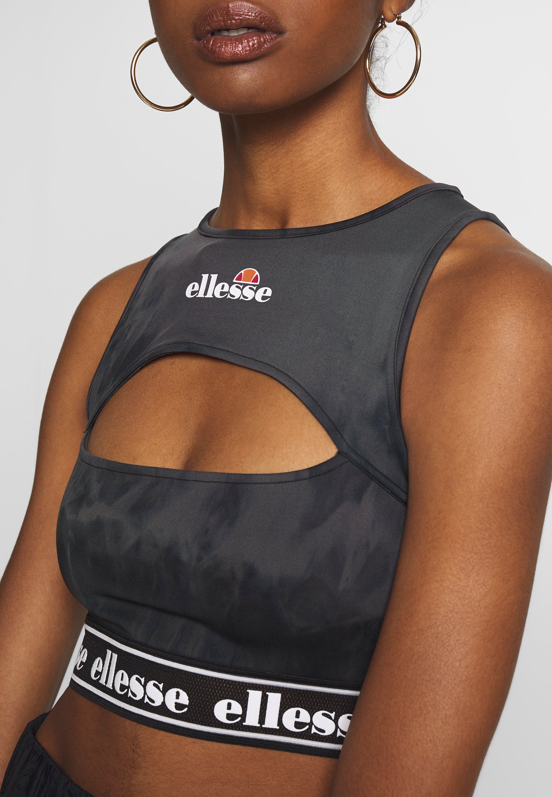 Ellesse FENZO Topper black Zalando.no Ellesse GOZZI X SMILEY - Topper - black
