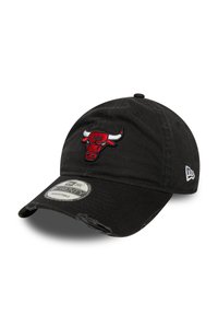Black cotton cap with adjustable strap, featuring an embroidered red and white Chicago Bulls logo on the front. Distressed brim detail.