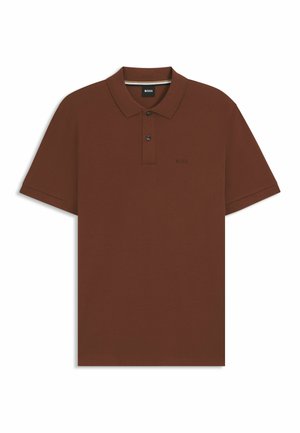 Brun polo t-shirt i en enfärgad design, tillverkad av mjuk bomull, med klassisk krage, tvåknapps knäppning och diskret broderad logotyp.