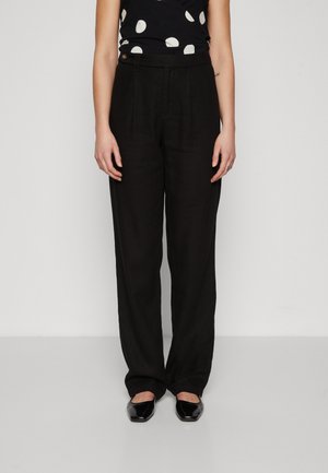 Black linen wide-leg trousers with front pleats, a high waistband, and a side button closure, paired with a polka dot top.