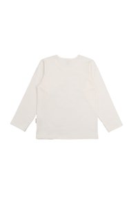 Langärmliges, rundhalstop Shirt aus weichem weißen Baumwollmaterial. Hat ein schlichtes Design ohne sichtbare Muster oder Akzente. Glatte Textur.