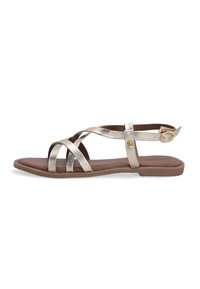 Metallisch goldene Sandalen mit Riemen und flacher Sohle, ausgestattet mit überkreuzten Riemen und einem verstellbaren Knöchelriemen. Strukturierte Oberseite und glatte Innensohle.