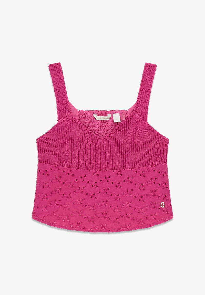 Haut rose sans manches avec un haut en tricot côtelé et un tissu brodé à œillets sur la moitié inférieure, doté de larges bretelles et d'un petit logo métallique "G".