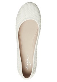 White flat shoe with a woven texture, rounded toe, and a smooth interior lining. Features a subtle logo on the insole.