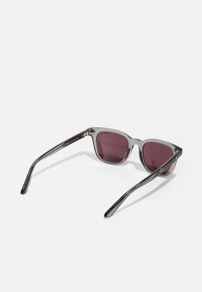 Gray translucent sunglasses with dark red lenses. Square shape, with slim, textured arms and subtle branding on the inner frame.