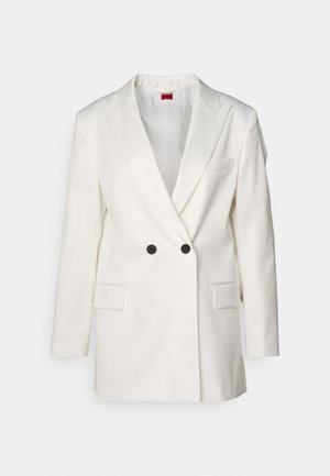 Hvit blazer laget av glatt stoff, med dobbelbrystet design, svarte knapper, snittet lapels og to frontlommer.