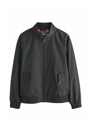 Melna bombera jaka no viegla auduma ar rāvējslēdzēju priekšpusē, divām kabatām ar pogām un iekšpusē ar svītrainu oderi.