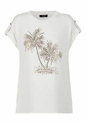 Witte blouse met korte mouwen met opgerolde manchetten en een metalen palmboomdesign op de voorkant.