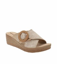 Sandales compensées beiges avec une sangle texturée et un accent circulaire. Matériau doux et tissé avec une semelle à motif. Talon surélevé pour plus de hauteur.