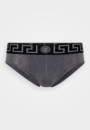 Graue Baumwollunterhosen mit einem schwarzen elastischen Bund, der ein sich wiederholendes griechisches Schlüsselmuster und ein zentrales Logo-Element aufweist.