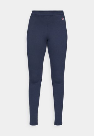 Leggings blu navy realizzati in tessuto elastico, caratterizzati da un design aderente con una vita liscia e un piccolo logo accentato sull'anca.