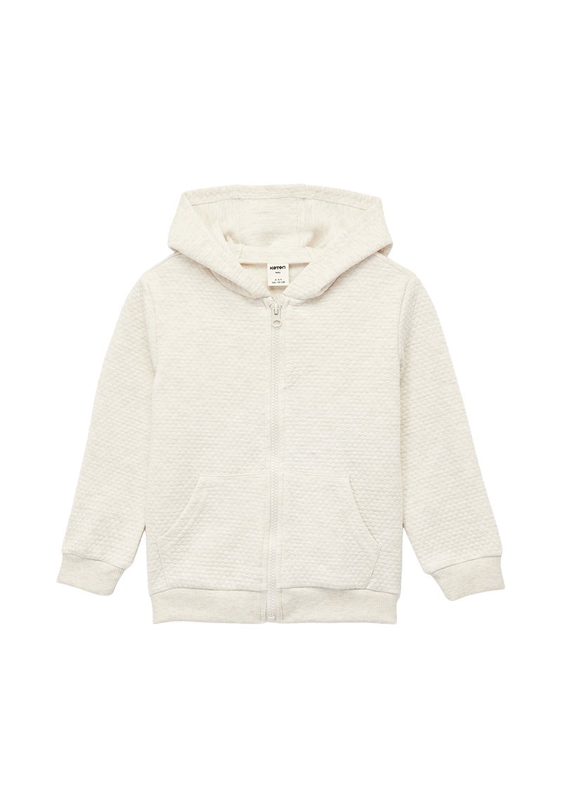 Sudadera con cremallera en gris claro, fabricada en tejido texturizado, con una cremallera frontal, dos bolsillos delanteros y capucha forrada. Ajuste casual con puños y dobladillo acanalados.