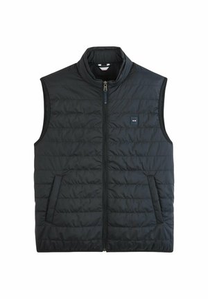 Gilet rembourré noir avec un col montant, fermeture éclair avant et poches latérales. Présente une texture matelassée et un petit logo sur la poitrine.