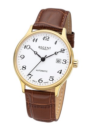 Montre ronde en ton or avec un cadran blanc, des chiffres arabes noirs et un affichage de la date. Le bracelet en cuir marron présente un motif crocodile.