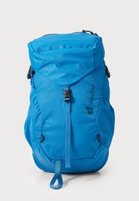 Blue backpack with a roll-top design, made of durable fabric. Features buckles, adjustable straps, and logo detail on the side.