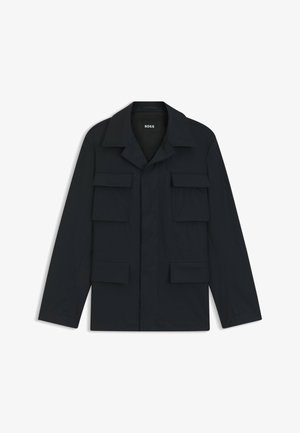 Navy blue utility jacket made of lightweight fabric, featuring a classic collar and four front pockets. Straight cut with long sleeves.