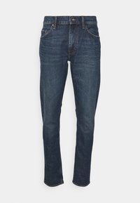 Tmavě modré denimové džíny s přímým střihem, stylem s pěti kapsami a zapínáním na knoflíky. Jemné vyblednutí a kontrastní švy.