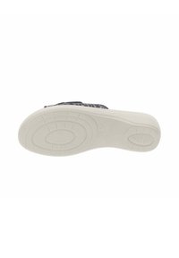 Zapato sin cordones con parte superior texturizada en navy y suela flexible de goma blanca. Cuenta con una plantilla acolchada para mayor comodidad.