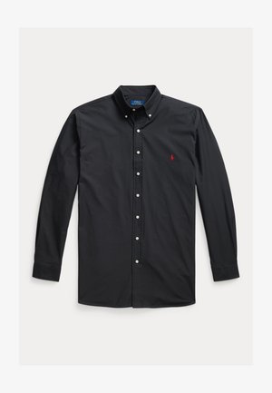 Black long-sleeve button-down shirt made of cotton with a pointed collar, featuring white buttons and a small red logo on the left chest.