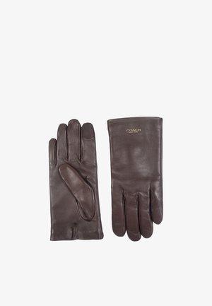Gants en cuir marron avec une texture lisse, comprenant cinq doigts et un poignet légèrement plus long. Logo Coach embossé sur le poignet.