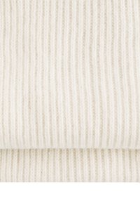 Ribbed knit fabric in off-white, showcasing fine, vertical lines and a soft texture, emphasizing warmth and thickness.
