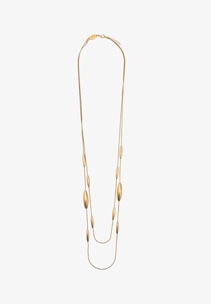 Długi złoty naszyjnik z dwiema cienkimi łańcuszkami i wieloma wydłużonymi owalnymi koralikami równomiernie rozmieszczonymi. Zapięcie z regulowanym przedłużaczem łańcuszka.