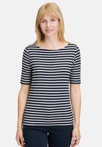 Granatowa i kremowa bluzka w paski z krótkimi rękawami, okrągłym dekoltem oraz dopasowanym krojem, wykonana z miękkiego, elastycznego materiału.