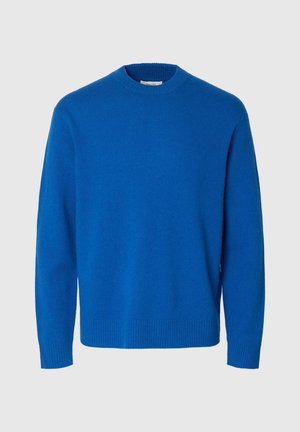 Sinine villane kampsun, ümmarguse kaelusega, pikkade varrukatega ning soonikkoes mansettide ja äärega. Siledapinnaline ja ühevärviline, ilma mustrite või kaunistusteta.