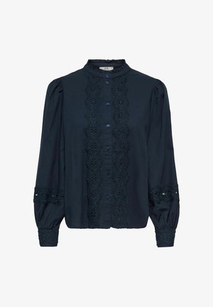 Blouse bleu marine à manches longues avec bordure en dentelle florale sur le devant, aux poignets et autour du milieu des manches, dotée d'épaules bouffantes froncées et d'une fermeture à boutons.