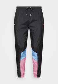 Black track pants with pink and blue chevron panels on lower legs and black drawstring waistband.