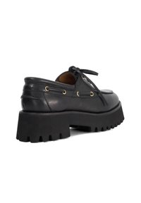 Black leather lace-up shoe with a rounded toe, chunky rubber sole, and gold eyelets for laces. Smooth texture with a classic design.