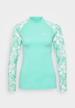 T-shirt de protection à manches longues turquoise avec un motif floral blanc sur les manches, design ajusté et col rond. Fabriqué à partir d'un tissu lisse et extensible.