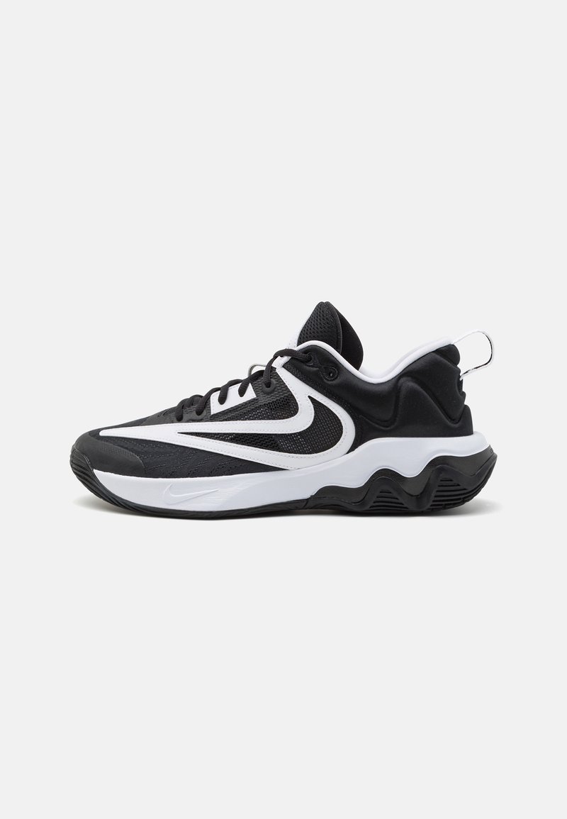Juoda ir balta sportinė sneaker'io avalynė su tinklinio viršumi, tekstūruotomis detalėmis, banguota vidine būtimi ir užtrauktuku ant kulno.