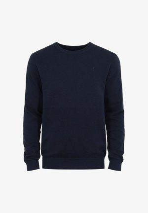 Granatowy sweter dzianinowy z okrągłym dekoltem, długimi rękawami oraz ściągaczami przy mankietach i dolnym brzegu. Posiada małe, tonowane logo na piersi.