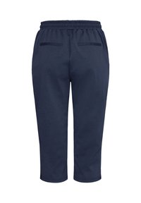 Pantalon court bleu marine avec taille élastique et deux poches passepoilées à l'arrière, présenté de dos sur fond blanc.