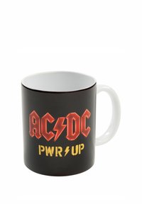 Tazza in ceramica nera con manico bianco. Presenta il logo rosso "AC/DC" e il testo giallo "PWR UP", con accenti a forma di fulmine. Finitura liscia.
