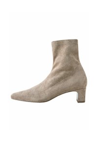 Beige suede ankle boot with a pointed toe, short shaft, and a small block heel. Seam detailing along the sides adds subtle texture.