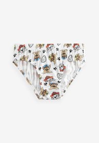 Slip da bagno bianchi con un motivo di cani giocosi, con cani da fumetto in diverse pose e colori, impronte di zampa nere e vita elastica.