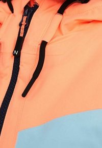 Bright orange jacket section with a light blue panel, featuring a black zipper and adjustable drawstrings. Smooth texture, lightweight material.