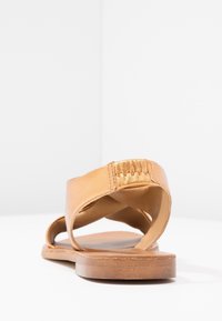 KIOMI Sandaalit nilkkaremmillä - bronze