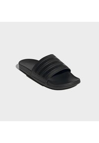 Black slide sandal with a wide strap featuring three horizontal ridges. Soft material, rounded toe, and flat sole design.