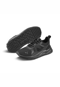 Zapatillas deportivas negras con parte superior de malla transpirable, suela acolchada, suela de goma texturizada con patrones de agarre y detalles de logotipo.