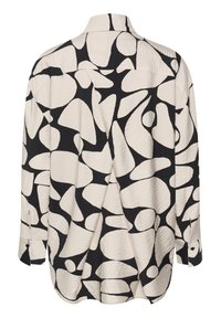 Kreemjas ja mustas toonis pikakäistega särk, mille pinnal on tekstuur, esitledes abstraktset mustridiagrammi ja klassikalist kraed.