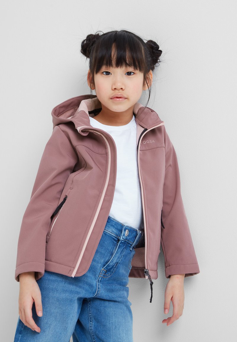 Pink softshell jacket with a hood, white lining, and front zipper. Paired with blue denim jeans. Simple, functional design.