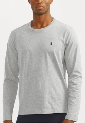 Grijs sweatshirt met lange mouwen, gemaakt van zachte katoen, met een klein zwart logo op de borst en een losse pasvorm.