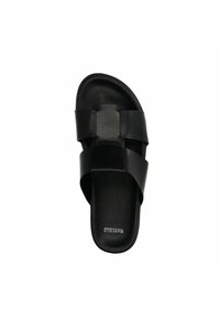 Black slide sandal with two wide straps and a flat sole, made of smooth leather. Features brand name "Wanfeld" embossed on the insole.