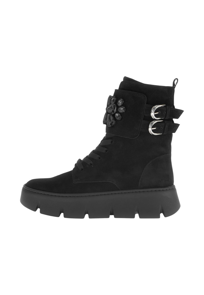Black suede ankle boots featuring a textured upper, flat platform sole, lace-up design, and silver buckles with a decorative stone accent.